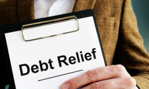 Debt relief application with clipboard for signing.